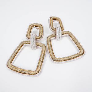 gold and silver interlock earrings 